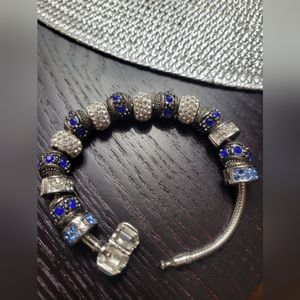 Bracelet With Blue Rhinestone Charms And Barrel Like Clasp